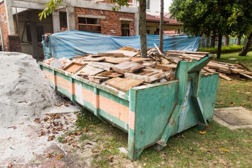 Crew sorting items during a Queens Park flat clearance for recycling and reuse